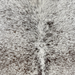Closeup of this XXL Tricolor Speckled Brazilian Cowhide, showing white with black and dark brown speckles (BRSP3820)