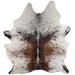 Large Tricolor Speckled Brazilian Cowhide: white with black and brown speckles and spots, a mix of black and brown down both sides of the spine, and one brand mark on the right side of the butt - 7'6" x 5'9" (BRSP3827)