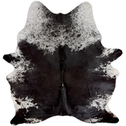 XL Black and White Speckled Brazilian Cowhide: mostly solid black on the back with hints of dark brown mixed in, a few white speckles on the spine, and white with black speckles and spots on the shoulder, belly, and shanks - 8'3" x 6'3"(BRSP3836)