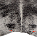 Closeup of this Large Black and White Speckled Brazilian Cowhide, showing  one brand mark on the left side of the butt and one on right side (BRSP3840)