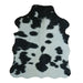 Black and White cowhide rug, 4' x 3', shown on white background (SS-BW-002)