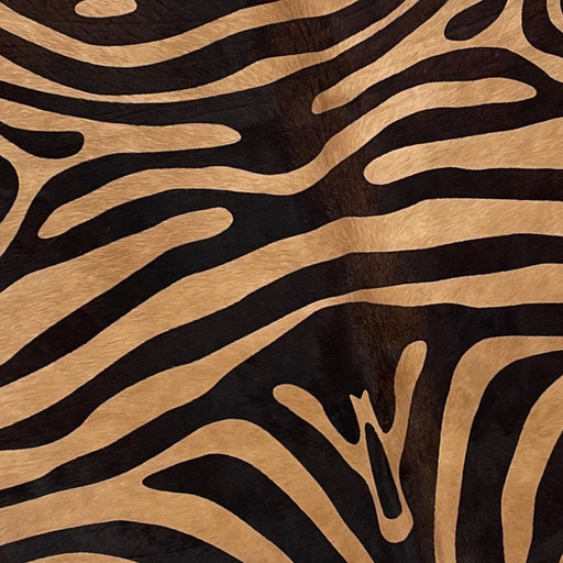 Closeup of this Brown, Brazilian Cowhide, showing a black, zebra print  (BRZP045)
