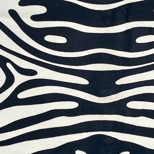 Closeup of this Brazilian Zebra Cowhide, showing white with a black, stenciled zebra print (BRZP046)