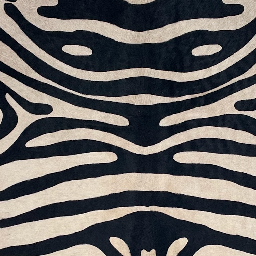 Closeup of this Brazilian Zebra Cowhide, showing light beige with black, stenciled,  zebra print  (BRZP047)