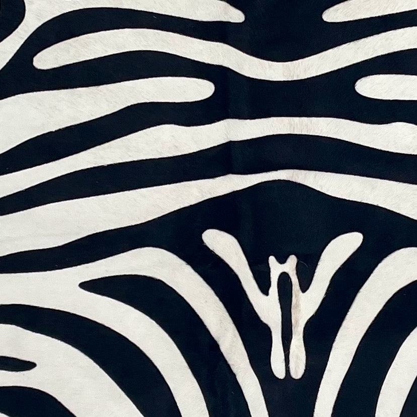 Closeup of this Brazilian Zebra Cowhide, showing white Brazilian cowhide with black, stenciled zebra print (BRZP048)