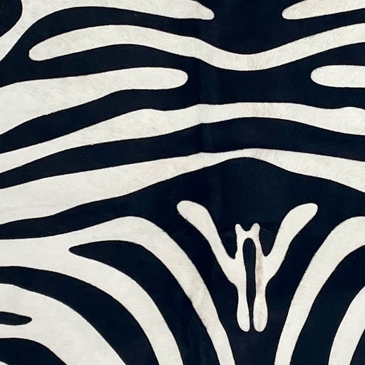 Closeup of this Brazilian Zebra Cowhide, showing white Brazilian cowhide with black, stenciled zebra print (BRZP048)
