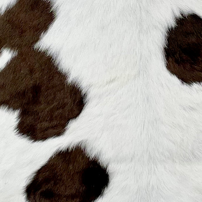Closeup of this White and Chocolate Calfskin, showing white with chocolate spots (CALF599)