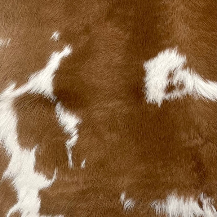 Closeup of this Brown and White Calfskin, showing brown with white spots (CALF621)