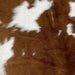 Closeup of this Brown and White Calfskin, showing brown with a few white spots (CALF629)