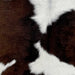 Closeup of this Calfskin, showing white with large and small, dark chocolate spots (CALF748)