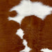 Closeup of this Calfskin, showing brown with large and small, white spots  (CALF840)