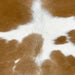 Closeup of this Calfskin, showing white with large and small, caramel spots  (CALF850)