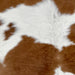 Closeup of this Calfskin, showing white with large and small, brown spots  (CALF857)
