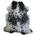 Black and White cowhide rug, 7'6" x 6'5", shown on white background (CH-031)