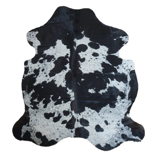 Black and White cowhide rug, 7'3" x 6'6", shown on white background (CH-039)