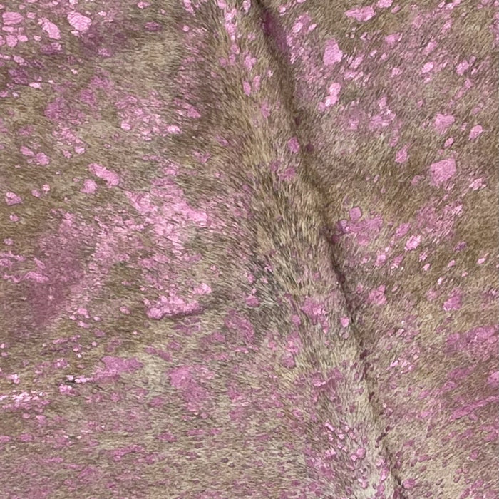 Closeup of this Colombian, Light Brindle Cowhide, showing a Pink Acid wash  (COAW388)