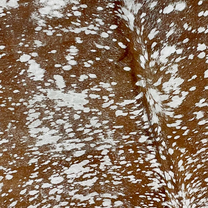 Closeup of this Brown, Colombian Cowhide, showing a Silver, metallic Acid Wash  (COAW390)