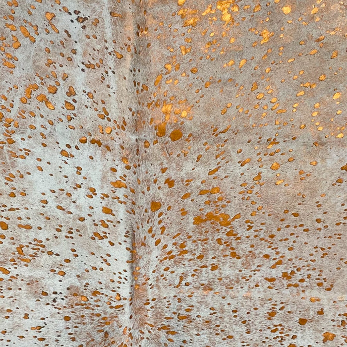 Closeup of this White and Black, Speckled, Colombian Cowhide, showing an Orange Acid Wash (COAW437)