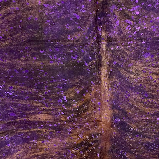 Closeup of this Colombian Brindle Cowhide, showing brown and black, and a metallic, Purple Acid Wash (COAW503)