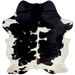 Black and White Colombian Cowhide:  white with large and small, black spots, brown on part of the spine, and white on the belly - 6'9" x 5'3" (COBKW237)