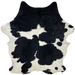 Large Black and White Colombian Cowhide: white and off-white with large and small, black spots, and it has long hair down part of the spine and on the belly - 7'6" x 5'7" (COBKW274)