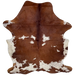 Reddish Brown and White Colombian Cowhide: reddish brown with large and small, white spots that have reddish brown speckles - 6'9"x 5' (COBNW357)
