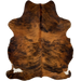 Reddish Brown and Black Colombian Brindle Cowhide:  reddish brown with black, brindle markings, and it has a splash of white on both hind shanks - 7' x 5'8" (COBR1147)
