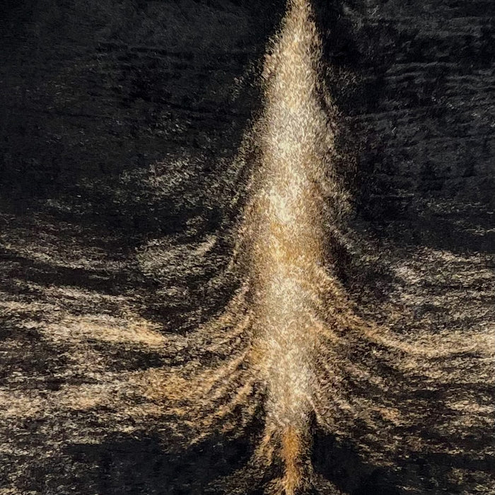 Closeup of this Large Colombian Brindle Cowhide, showing black with brown and off-white, brindle markings down the middle, and off-white and brown down part of the spine (COBR1599)