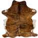 Reddish Brown and Black Colombian Brindle Cowhide: reddish brown with black, brindle markings, white on the belly and part of the shanks, and longer hair down the spine and on the belly  7'4" x 5'5" (COBR1602)