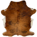Reddish Brown and Black Colombian Brindle Cowhide: has long hair that is reddish brown with black, brindle markings, and white on the belly - 6'7" x 4'10" (COBR1609)