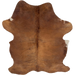 Solid Brown Colombian Cowhide: solid brown with longer hair down the spine and on the belly, and one small white spot on the edge of each side - 7'5" x 5' (COSL264)