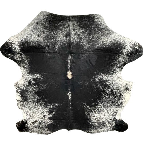 Large Black and White Speckled Colombian Cowhide: mostly solid black down the middle, with a few white speckles, white with black speckles and spots on the sides, belly, shoulder, and shanks, and a light beige spot on the spine - 7'6" x 6'2"(COSP3347)