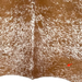 closeup of this Brown and White Speckled Colombian Cowhide, showing one brand mark on the right side of the butt (COSP3572)