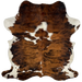 Colombian Tricolor Cowhide:  has a brown and black, brindle pattern, with some large and small, white spots, and it has off-white on the belly and part of the shanks - 7'2" x 5' (COTR1011)