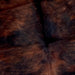 Closeup of this Colombian, Dark Tricolor Cowhide, showing long hair that has mix of black and reddish brown covering most of the hide (COTR1037)