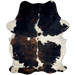 Colombian Tricolor Cowhide:  white with large spots down both sides that have a black and brown, brindle pattern, and it has a few smaller spots on the back and shanks - 6'11" x 5' (COTR1047)