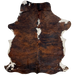 Colombian Tricolor Cowhide:  has a reddish brown and black, brindle pattern, with two white spots in the middle of the shoulder, and white on part of the belly and shanks - 6'10" x 5'2" (COTR1140)