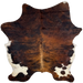 Colombian Tricolor Cowhide:  has a reddish brown and black, brindle pattern, light brown down part of the spine, and white, with black speckles, on part of the belly and butt - 7'4" x 5'10" (COTR1141)