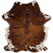 Large Colombian Tricolor Cowhide:  has a red brown and black, brindle pattern, with a few small, white spots on the back, and it has white, with black and red brown speckles and spots, on the belly, butt, and shanks - 7'7" x 5'8" (COTR1187)