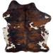 Colombian Tricolor Cowhide: has a reddish brown and black, brindle pattern, and white spots that have brown and black speckles and spots on the belly, shanks, and back - 6'10" x 5'7" (COTR1219)