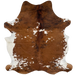 Colombian Tricolor Cowhide: mostly brown, with some black, brindle markings, and it has white spots on the back and white on the belly - 6'10" x 5' (COTR1222)