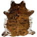 Colombian Tricolor Cowhide: has a brown and black, brindle pattern, with a few small, white spots down the middle, and white with black and brown speckles and spots on the belly and shanks - 6'9" x 5' (COTR1223)