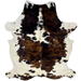 Colombian Tricolor Cowhide: white with faint, black speckles, and large and small spots that have a brown and black, brindle pattern, and it has longer hair down the spine - 7' x 4'11" (COTR1236)