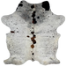 Colombian Tricolor Cowhide: has a mix of white and off-white, with black and brown speckles, and spots down the middle that have a mix of brown and black - 7'3" x 5'3" (COTR1240)