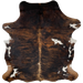 Colombian Tricolor Cowhide: has a black and brown, brindle pattern, with a small, white spot on the right side of the back, and white spots on the belly and shanks - 6'8" x 5'3" (COTR1245)