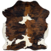 Colombian Tricolor Cowhide: has long hair that is white with large spots that have a mix of reddish brown and black - 5'11" x 5'2" (COTR1264)