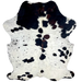 Colombian Speckled Tricolor Cowhide: white with black speckles and spots, faint, cloudy speckles, and some spots that have a mix of black and dark brown on the spine and shoulder, and longer hair in the middle of the shoulder - 7'1" x 5'4" (COTR1280)