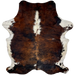 Colombian Tricolor Cowhide: long hair that has a mix of reddish brown and black, with white down part of the spine and on the belly and shanks - 7'1" x 5'5" (COTR1285)