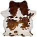 Colombian Tricolor Cowhide: white and off-white, with large and small spots that have brown and reddish brown with a black, brindle pattern, and it has long hair in the middle of the shoulder - 7'2" x 5'7" (COTR1292)