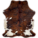 Colombian Tricolor Cowhide: has a red brown and black, brindle pattern, with a few small, white spots, down the middle, and along the edge of the butt and hind shanks, and it has off-white with brown and black speckles on the belly and part of the butt, and longer hair on the belly - 7'5" x 5'7" (COTR1293)